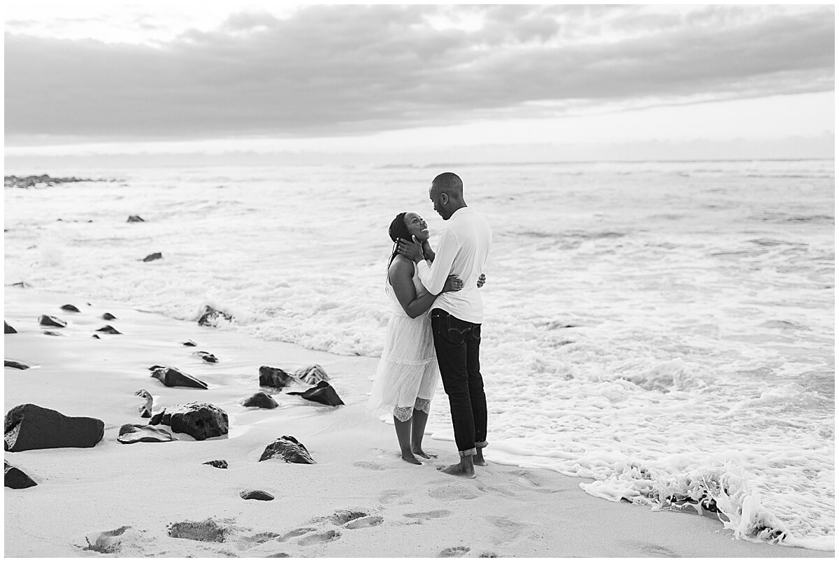 woman wearing white dress on the Hawaiian beach during Oahu surprise proposal 